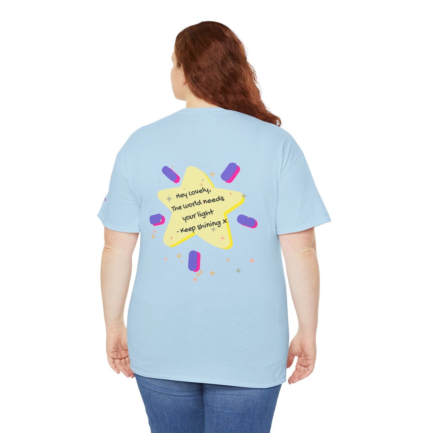 Light blue t-shirt with a colorful star design on the back, worn by a person.