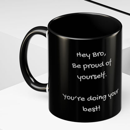 Black mug with grey writing design on a white surface