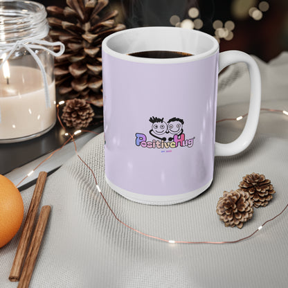White mug with 'Positive Hug' logo on a table with decorative items