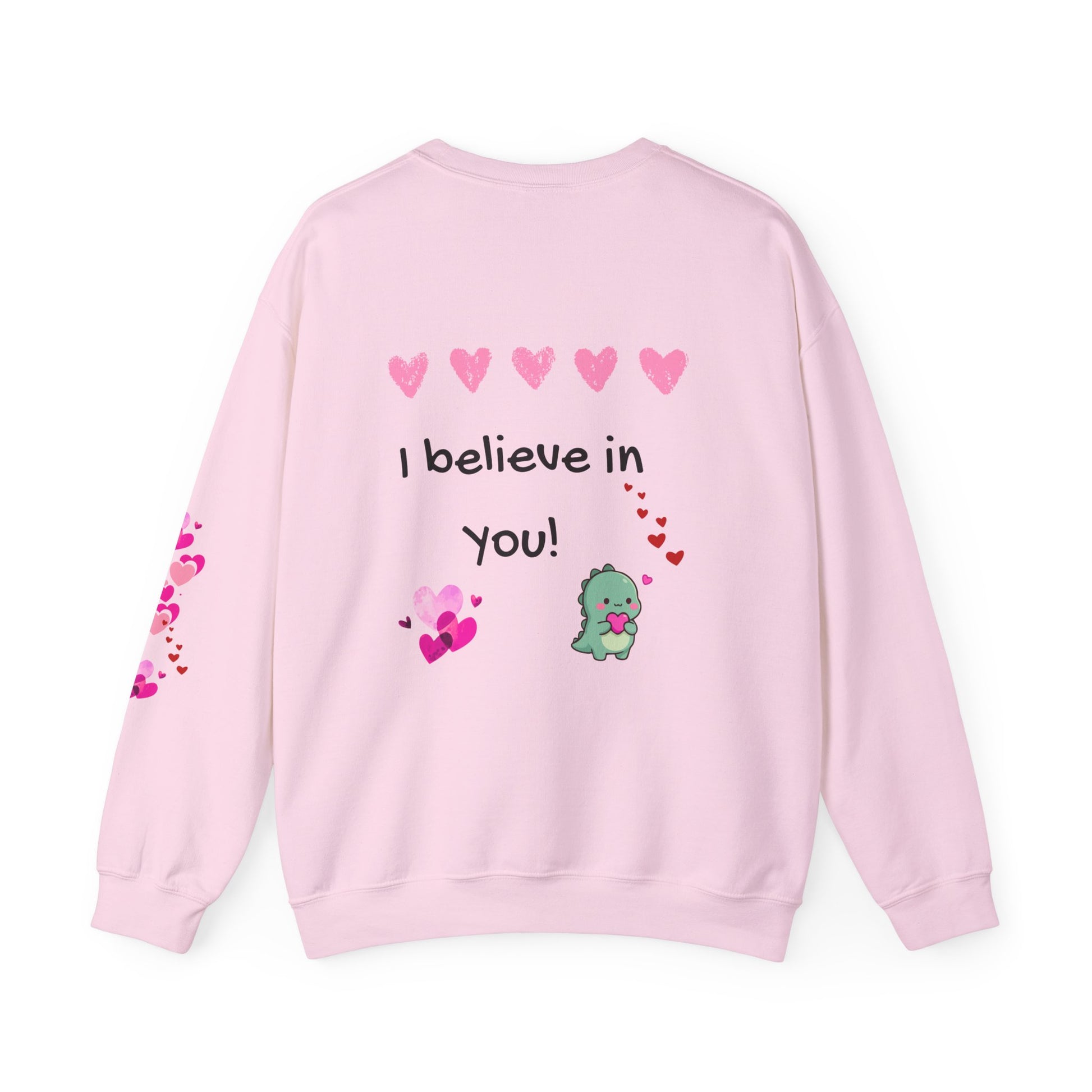 Pink sweatshirt with 'I believe in you!' text and heart designs on a white background