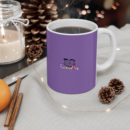 Purple mug with a logo on a table with decorative items