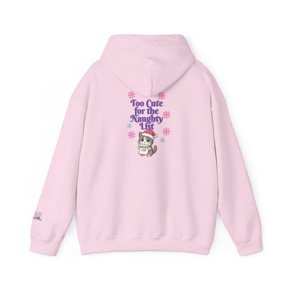 A light pink pullover hoodie shown from the back, featuring a graphic print of a cute cartoon cat in a Santa hat with the text 'Too Cute for the Naughty List' surrounded by purple and pink snowflakes.