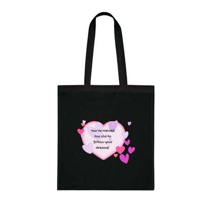Black tote bag with a heart-shaped design and text on a white background