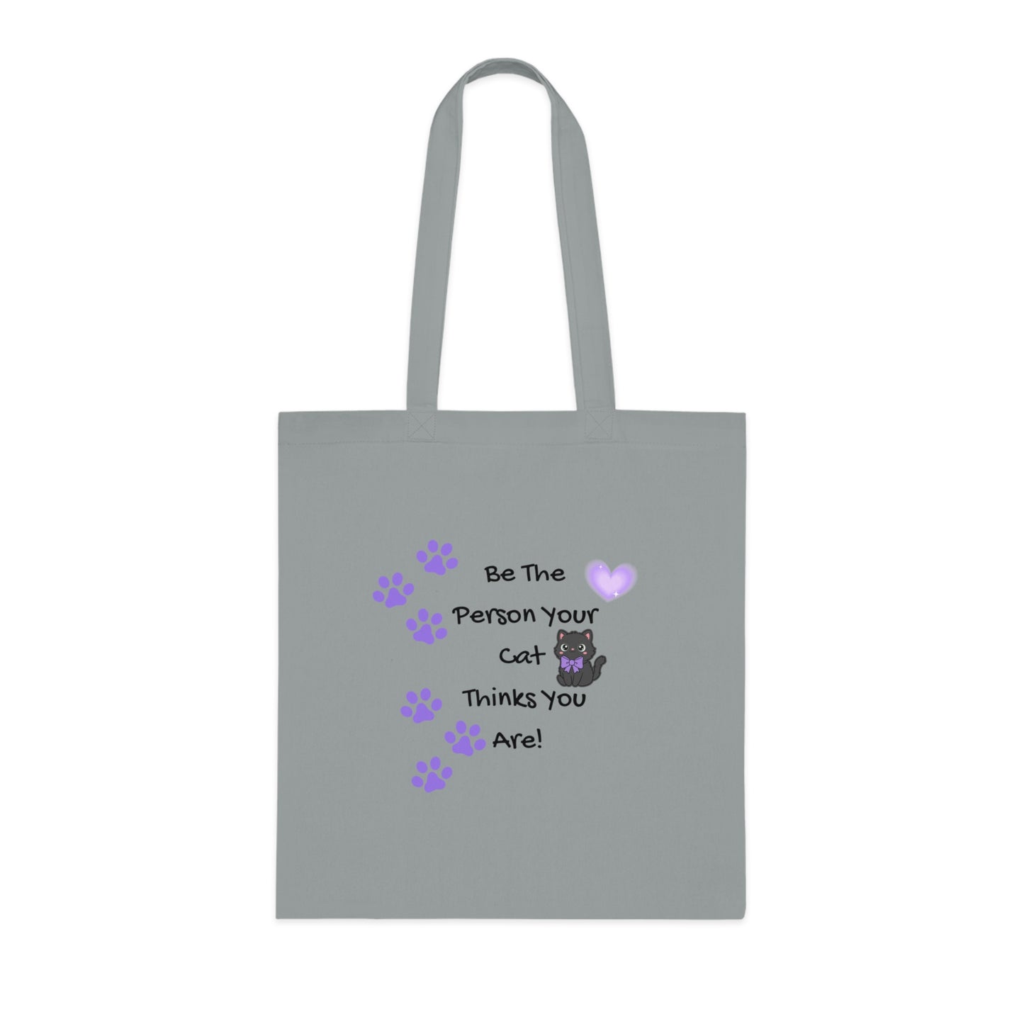 Gray tote bag with a cat-themed message and paw prints on a white background