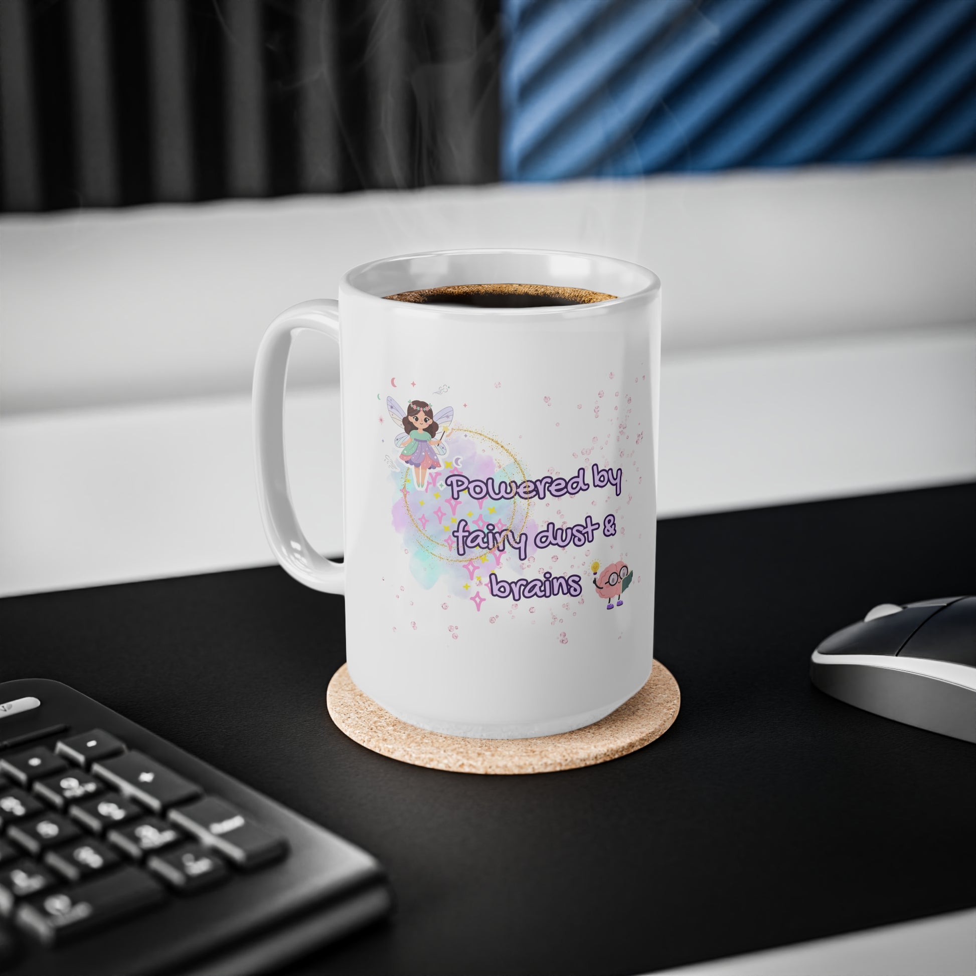 White mug with text and graphics on a desk with a keyboard and mouse.