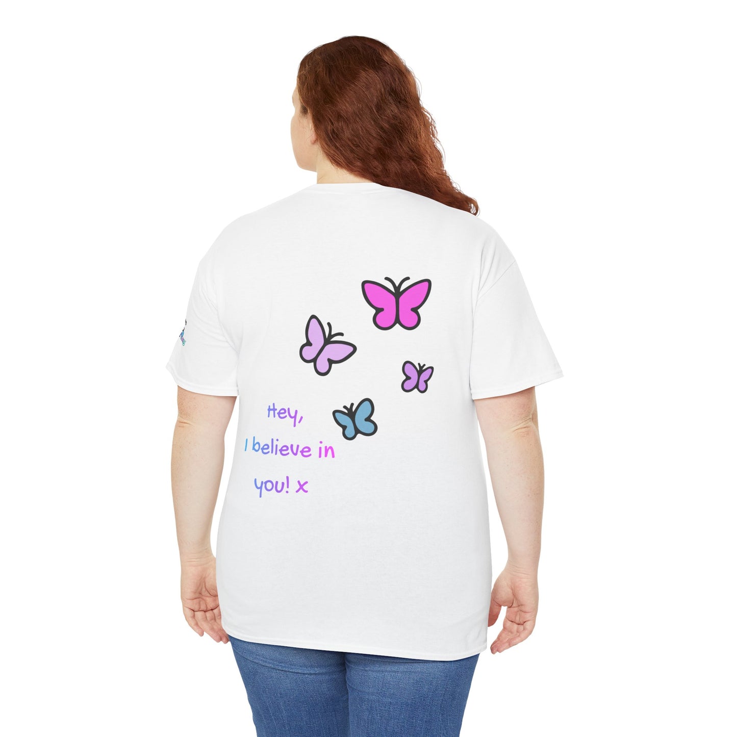 Person wearing a white t-shirt with colorful butterfly designs and text on the back.