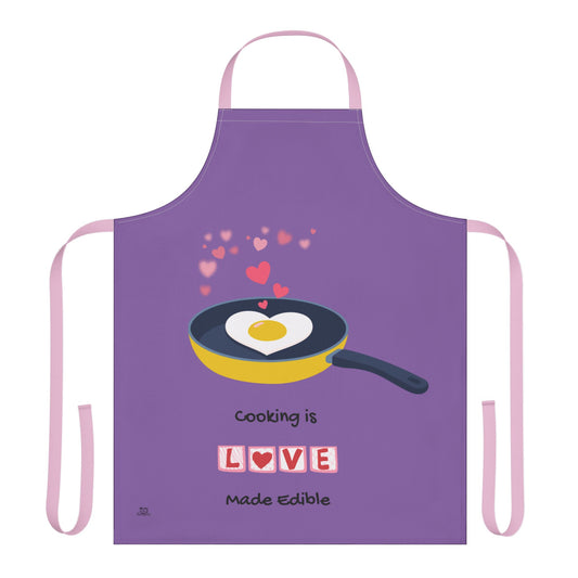 Purple apron with a frying pan graphic and 'Cooking is Love Made Edible' text on a white background