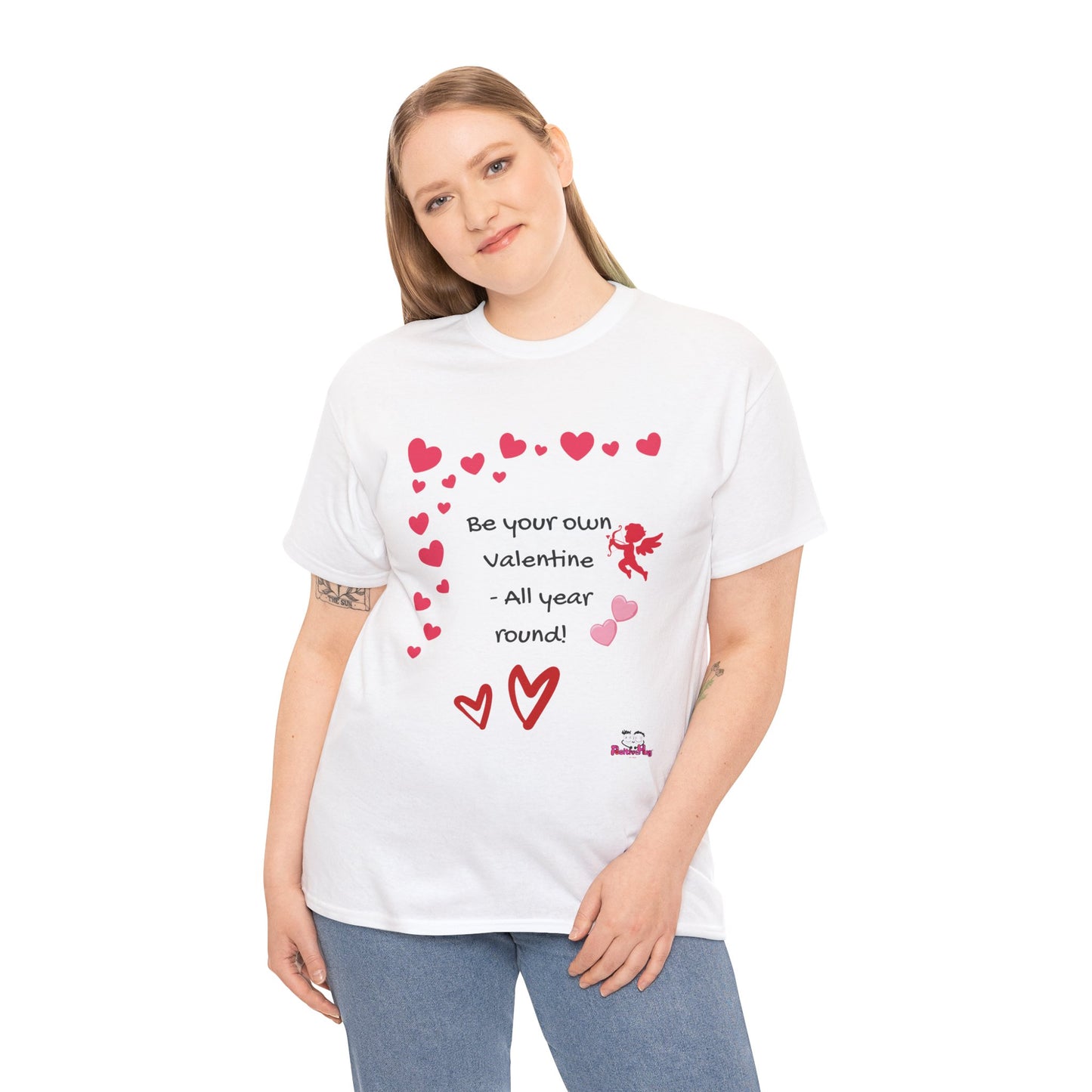 Person wearing a white t-shirt with red heart designs and text on a white background