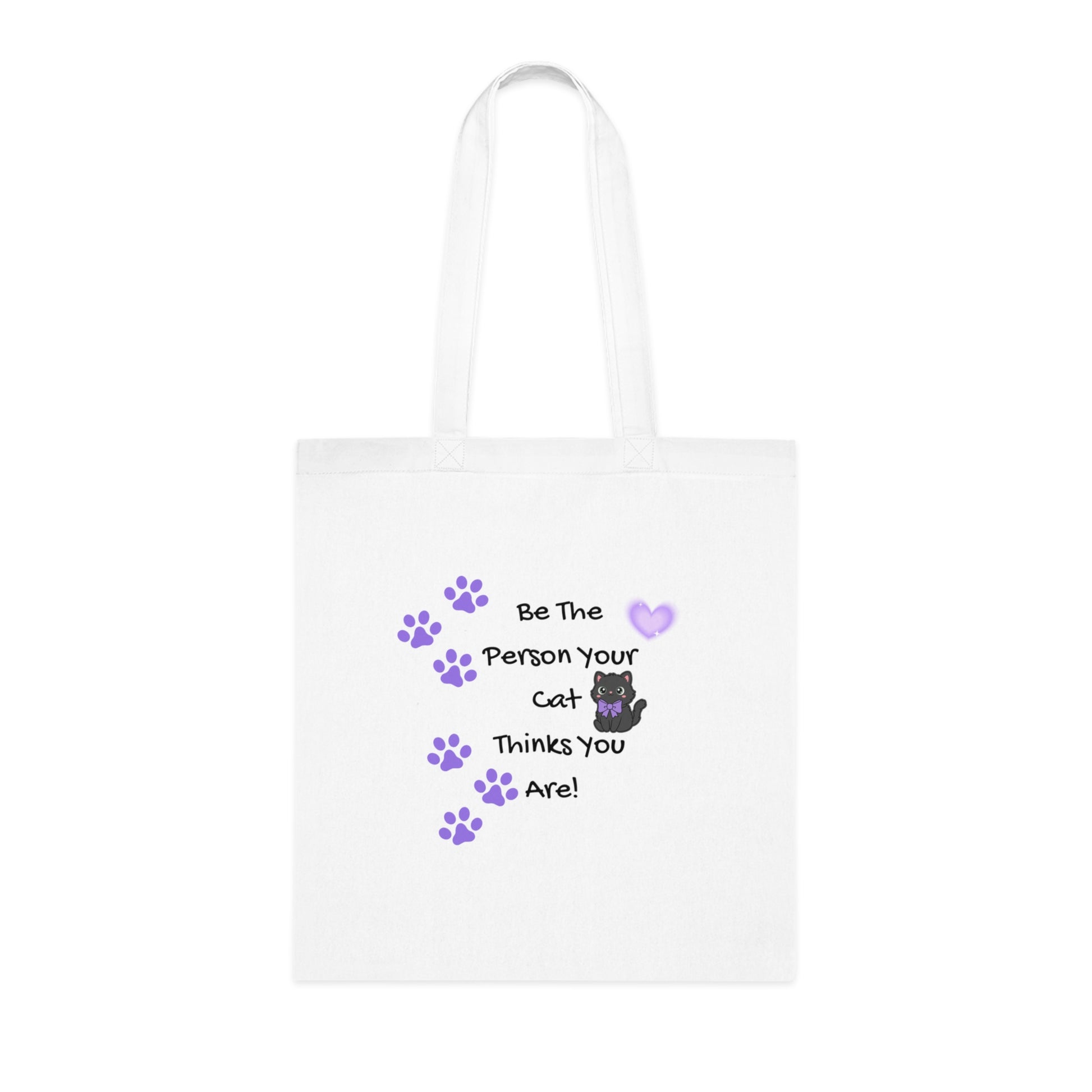 White tote bag with cat-themed text and graphics on a white background