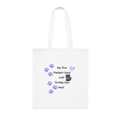 White tote bag with cat-themed text and graphics on a white background