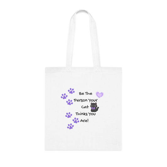 White tote bag with cat-themed text and graphics on a white background
